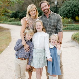 Dr. Word smiling with her husband and three kids