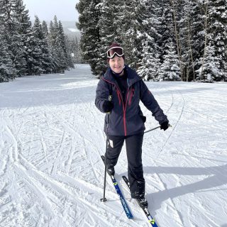 Dr. Moore skiing on a snowy mountain