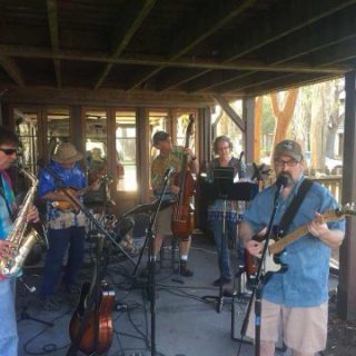 Dr. Davison and his band performing and playing music