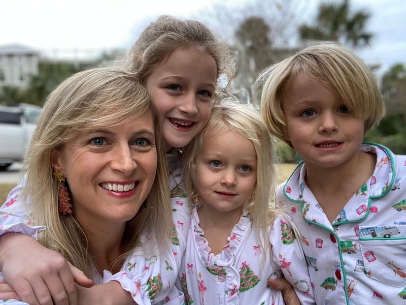 Dr. Word smiling with her three children